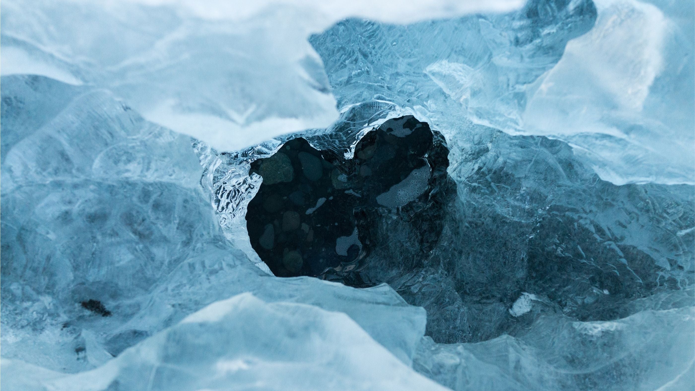 A close up of an ice hole, symbolising ice baths place in fitness recovery.